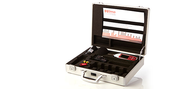 An image showing the Optimus+ Yellow simple sound level meter accompanied by its accessories, including acoustic calibrator and carry case